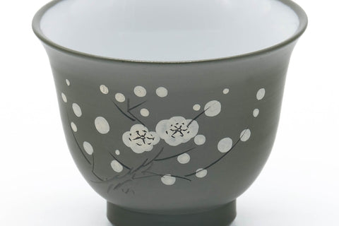 Tezumi — Japanese Teacup - Plum Blossom Ryokudei Tokoname White Inner-Glazed Yunomi - 60ml — tipped to show the interior