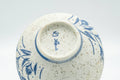 Tezumi — Japanese Teacups - Pair of Blue Floral Textured Arita-yaki Yunomi - 100ml — tipped to show the interior