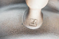 Closeup of the foot of the dark yohen kyusu showing the unglazed clay base and maker's stamp