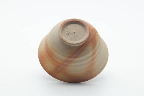 Tezumi — Japanese Teacup - Beige Orange Rice Straw Hidasuki Bizen-yaki Yunomi - 100ml — tipped to show the interior