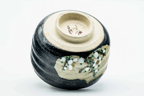 Inverted view of the black metallic chawan showing the foot and underside