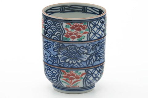 Tezumi — Japanese Teacup - Blue Floral Geometric Arita-yaki Yunomi - 245ml — tipped to show the interior