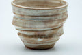 Tezumi — Japanese Teacup - Beige Cream Spotted Spiraling Yunomi - 220ml — tipped to show the interior