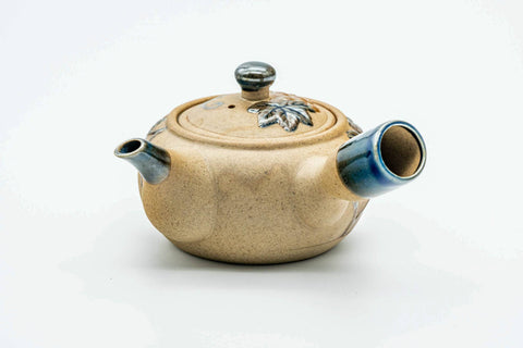 Rear three-quarter view of the kyusu showing the side handle.