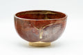 Japanese Matcha Bowl - Shiny Red and Yellow Drip-Glazed Wan-nari Chawan - 250ml - front view showing the shiny red glaze and yellow drips