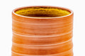 Close-up of a cup's interior, showing the yellow hakeme brushwork glaze.