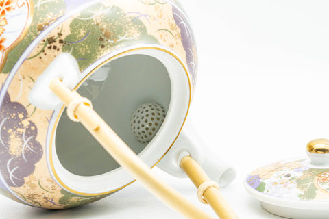 Japanese Tea Set - Floral Arita-yaki Dobin Teapot with 3 Lidded Yunomi Teacups - close-up of a cup with lid open showing the interior