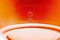 Underside of the red kyusu showing the foot and maker's mark.