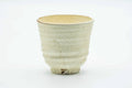 Side view of the teacup, showing the painted egret birds.