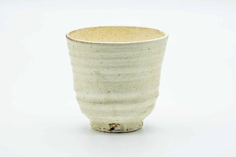 Side view of the teacup, showing the painted egret birds.