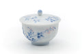 White Arita porcelain lidded yunomi teacup, front view, with blue floral painting and a domed lid.