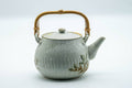 Tezumi — Japanese Tea Set - Beige Speckled Floral Kiyomizu-yaki Dobin Teapot with 5 Yunomi Teacups — interior of the teapot showing the filter