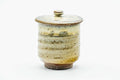 The lidded teacup from another angle, lid on.