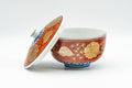Japanese Teacup - Red, Blue, and Gold Floral Geometric Arita-yaki Lidded Yunomi - 160ml - angled view with the lid propped against the cup