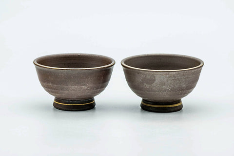 The pair from another angle, showing the dark brown exteriors.