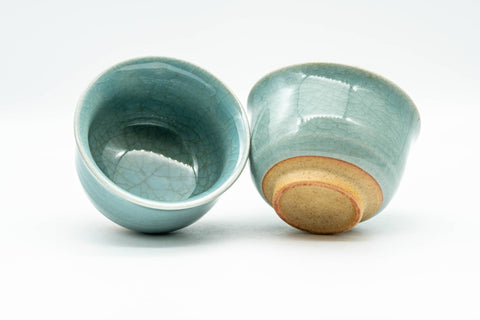 Japanese Teacups - Pair of Celadon Crazed Glazed Yunomi - 125ml - one cup upright beside another tipped to show its glazed interior