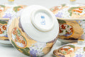 Japanese Tea Set - Floral Arita-yaki Dobin Teapot with 3 Lidded Yunomi Teacups - close-up of a lidded cup interior and base