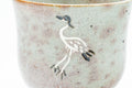 Japanese Matcha Bowl - Standing Crane Grey Pink Gohonte Glazed Winter Chawan with Tomobako Wooden Box - 450ml - wide view showing the crane decoration wrapping the bowl