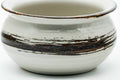 Slightly elevated front view emphasising the brown hakeme band over the white glaze.