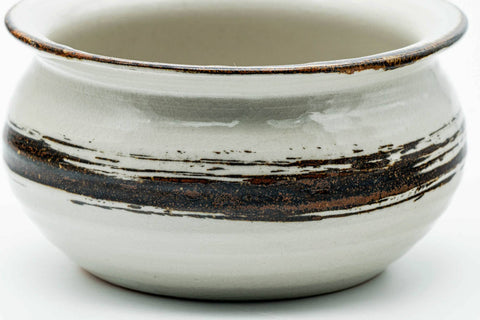 Slightly elevated front view emphasising the brown hakeme band over the white glaze.