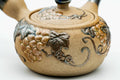 Close-up of the blue grapevine design on the body.