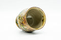Angled view looking into the cup's glazed interior and rim.