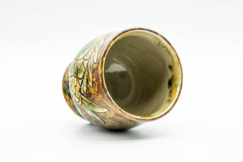 Angled view looking into the cup's glazed interior and rim.