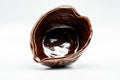 Overhead view into the katakuchi revealing the glossy burgundy glazed interior