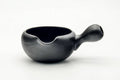 Side profile of the black yuzamashi with the side handle extended and the spout at left.