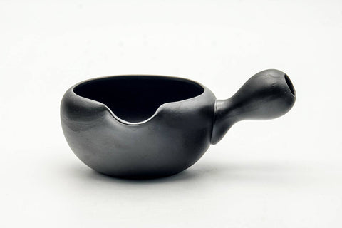 Side profile of the black yuzamashi with the side handle extended and the spout at left.
