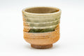 Japanese Tea Set - Set of 5 Uniquely Glazed Shigaraki-yaki Guinomi - 50ml - single ribbed green and beige glazed teacup, front view