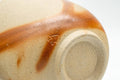 Tezumi — Japanese Teacup - 緋襷 Beige Orange Hidasuki Bizen-yaki Yunomi - 180ml — tipped to show the interior