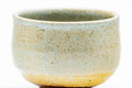 Tezumi — Japanese Teacup - Speckled Beige Gray Glazed Shigaraki-yaki Yunomi - 150ml — tipped to show the interior