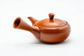 Side view of the teapot with the handle to the left.