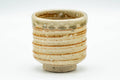 Japanese Tea Set - Set of 5 Uniquely Glazed Shigaraki-yaki Guinomi - 50ml - single beige and green glazed teacup, front view