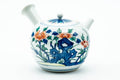 Japanese Kyusu - Blue Floral Porcelain Arita-yaki Ceramic Filter Teapot - 275ml - three-quarter view of the white porcelain body with blue and orange floral painting, lid on and side handle to the right