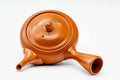 Overhead view of the red shudei Tokoname kyusu showing the lid knob and side handle