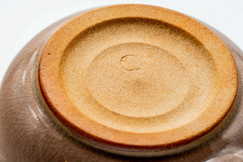 Underside of the pink-beige Hagi-yaki kyusu showing the unglazed clay foot ring
