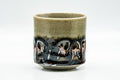 Three-quarter view of the Obori Soma yunomi showing the crazed celadon glaze and decorative band