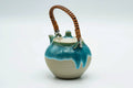 Turquoise Agano-yaki top-handled teapot, three-quarter view from the opposite side