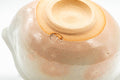 Japanese Tea Set - Hagi-yaki Katakuchi Water Cooler with 5 Guinomi Tea cups - closeup of the glazed interior base of the katakuchi