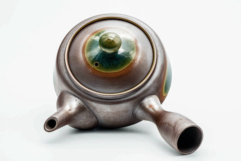 Overhead view of the kyusu, lid on, showing the handle and spout.