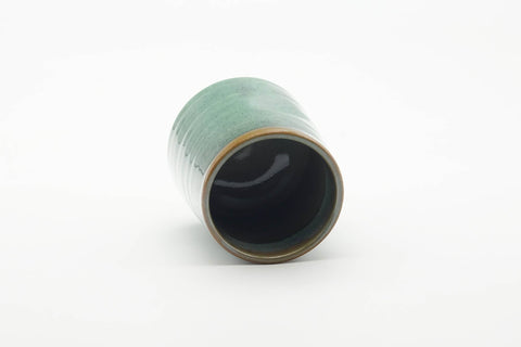 Tezumi — Japanese Teacup - Teal Speckled Thumb-Indented Yunomi - 180ml — tipped to show the interior