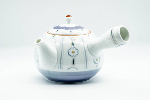 Three-quarter view of the chrysanthemum teapot with its side handle and spout