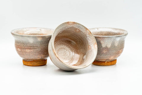 Japanese Teacups - Set of 3 Beige Drip-Glazed Gohonte Hagi-yaki Yunomi - 100ml - the cups grouped with one tilted showing the interior