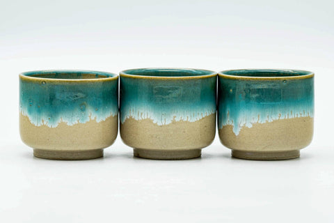 The three cups arranged in a row, front view.