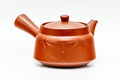 Three-quarter view of the teapot highlighting the engraved bamboo stalks around the body