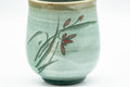 Japanese Teacup - Floral Green Celadon Glazed Yunomi - 180ml - three-quarter view of the floral decoration