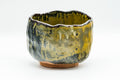 Japanese Matcha Bowl - Black and Yellow Undulating Wabi-Sabi Chawan - 450ml - front view of the undulating glazed bowl