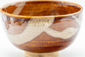 Japanese Matcha Bowl - Mottled Orange Glaze Wan-nari Chadamari Chawan - 300ml - close side view of the glazed exterior